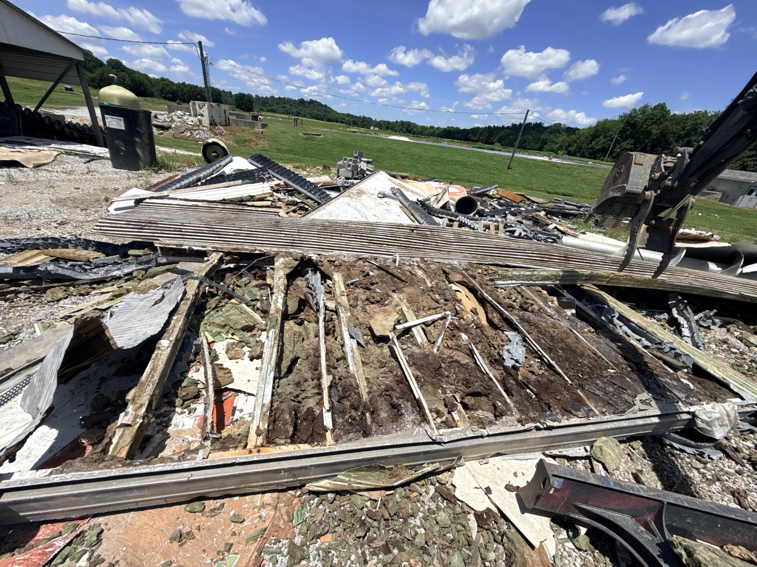 Debris and structural material during a barn demolition project